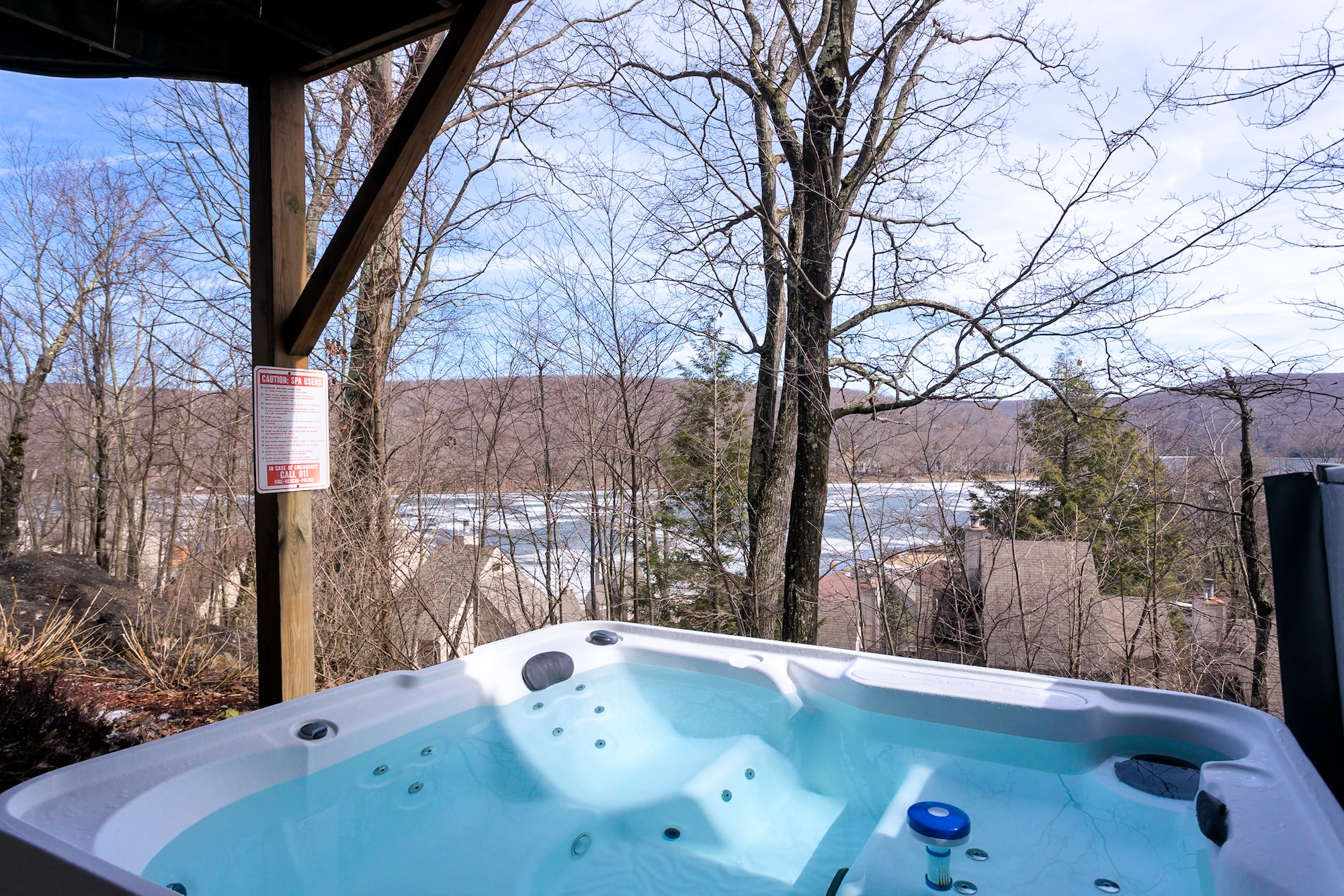 Covered hot tub with lake views