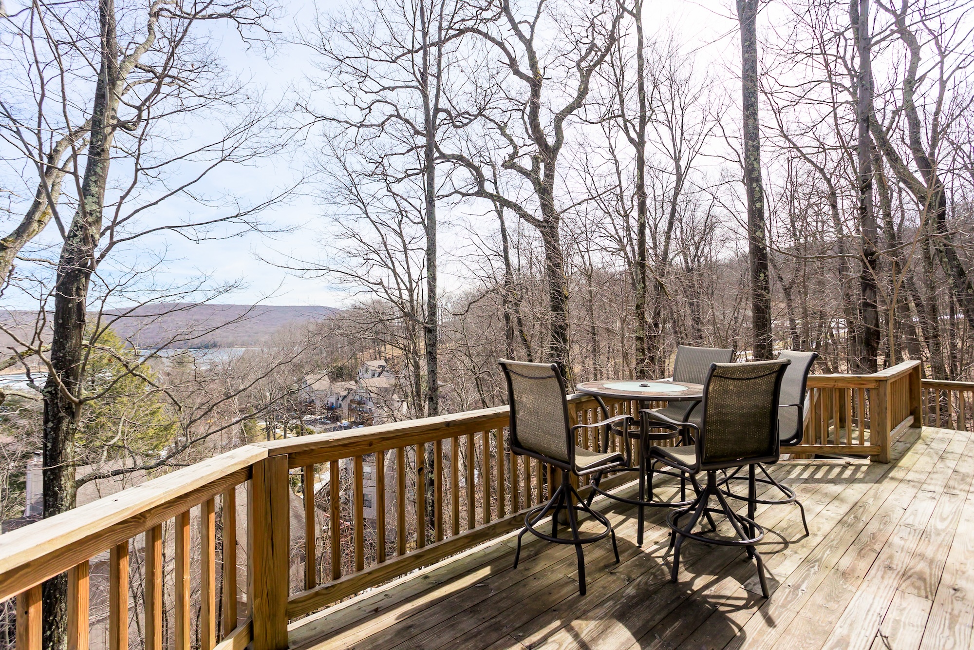 Deck with outdoor dining and lake views